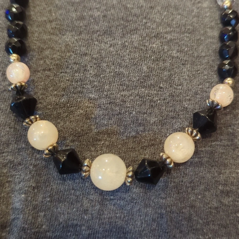 Women's black, pink‎ and clear ball necklace.